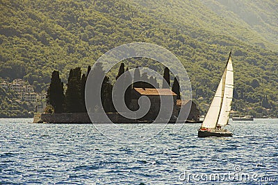 Sailing boat and Gospa od Skrpjela Stock Photo