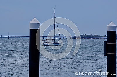 Sailing boat moored off jetty in Pumicestone Passage Queensland Stock Photo