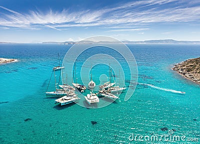 Sailing boats in star formation in Greece Polyaigos, Cyclades, sailing destinations Stock Photo