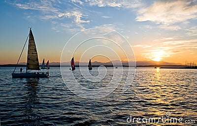 Sailing boats at sunset Stock Photo