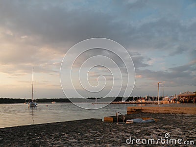 Sailing boats and yachts are floating on a peaceful surface of theAdriatic Sea,Croatia,Europe. In the background the coast with Me Stock Photo