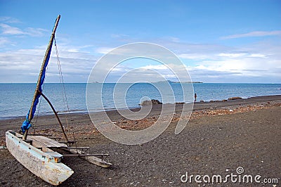 Sailing canoe at ocean beach Stock Photo