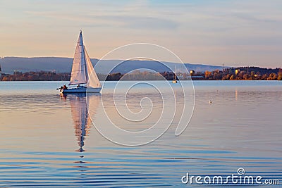 Sailing on lake Zug during sunset, Alps, Switzerland Stock Photo