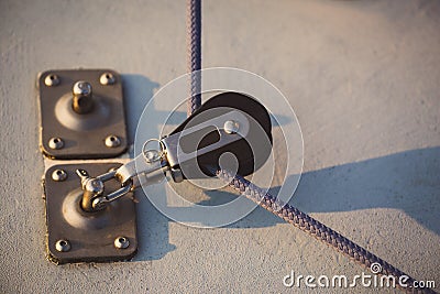 The sailing rope dragged by small block Stock Photo