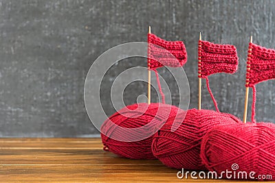 Sailing ships made from red yarn and knitting needles Stock Photo