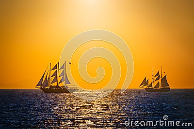 Sailing ships on the sea in sunset Stock Photo