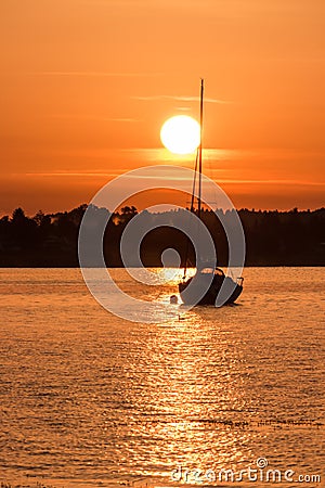 Sailing into the sunset Chiemsee Bavaria Germany Stock Photo