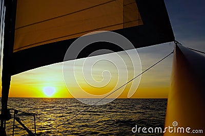 Sailing sunset Ocean Stock Photo