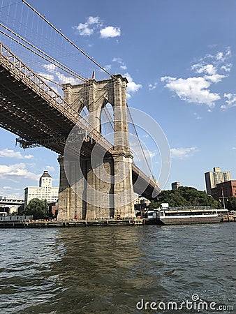 Sailing Under the Brooklyn Bridge, NYC Stock Photo