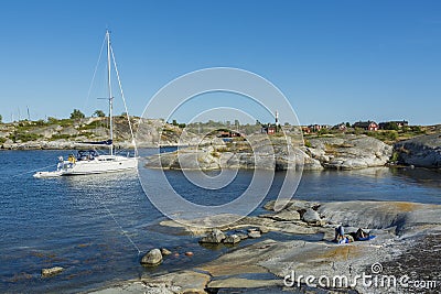 Sailingboat moored to cliff HuvudskÃ¤r Stockholm achipelago Editorial Stock Photo