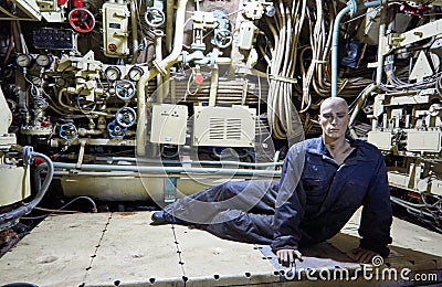 Sailor in the engine room in the submarine Editorial Stock Photo
