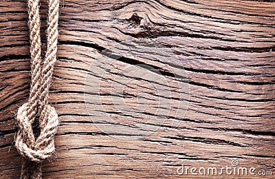 Sailor's knot over old wood. Stock Photo