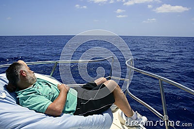 Sailor senior man having a rest on summer boat Stock Photo