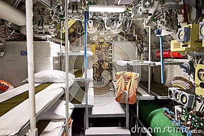 sailors' beds and other equipment in the compartment of an old diesel submarine Editorial Stock Photo
