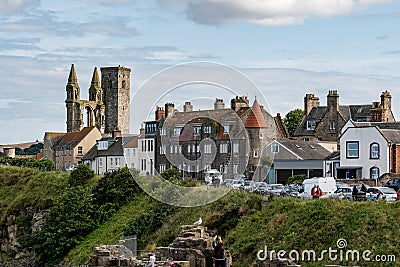 Cityscape of Saint Andrews city with St Rules Tower, ruins, and tourists Editorial Stock Photo