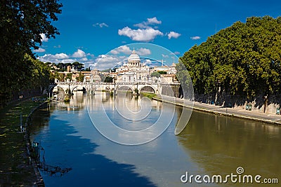 Saint Angelo Bridge and Basilica of St. Peter at night with the Vatican in the background in Rome, Italy Stock Photo