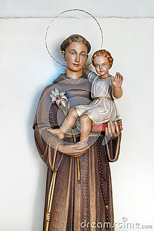 Saint Anthony holds a child of Jesus, a statue in the church of Saint Anthony of Padua in Zagreb, Croatia Stock Photo