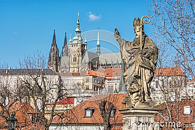 Saint Augustin statue, Charles Bridge and Prague castle Stock Photo