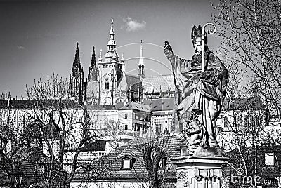 Saint Augustin statue, Charles Bridge and Prague castle Stock Photo