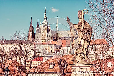 Saint Augustin statue, Charles Bridge and Prague castle Stock Photo