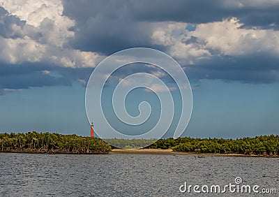 Saint Augustine lighthouse under some broken clouds with blue grey sky in the background Stock Photo