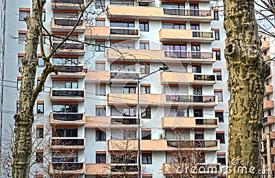 Saint-Etienne, France - January 27th 2020 : Focus on cyan and orange modern buildings known as 