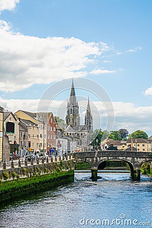 Saint Fin Barre`s Cathedral and south gate bridge on river Lee in Cork Stock Photo