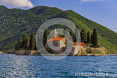 Saint George island with a centuries-old monastery and cemetery and cypress trees in the famous Bay of Kotor, Montenegro Stock Photo