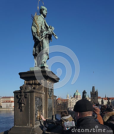 A saint on the historic Charles Bridge in Prague, Czech Republic Editorial Stock Photo