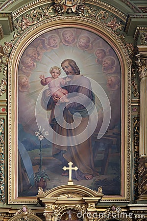 Saint Joseph holding child Jesus Stock Photo