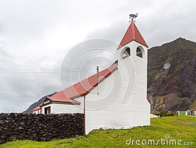 Saint Joseph`s Catholic church, Edinburgh of the Seven Seas town, Tristan da Cunha. A whale and cardinal direction pointer signs Stock Photo