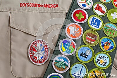 Eagle patch and merit badge sash on boy scout uniform Editorial Stock Photo