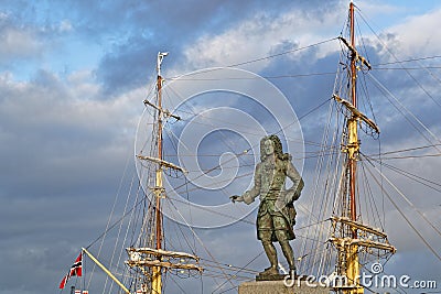 Duguay-Trouin statue in Saint-Malo and masts of an old ship Editorial Stock Photo