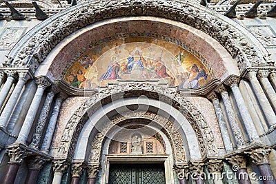 Saint Mark basilica facade details with golden, colorful mosaics in Venice Stock Photo