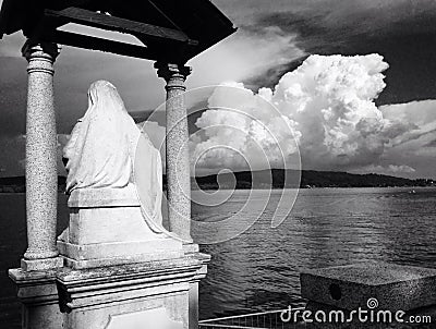Saint overlooking Lago Maggorie in Arona, Italy Stock Photo