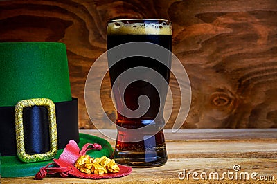 Saint Patrick day symbols green hat and leprechaun gold Stock Photo