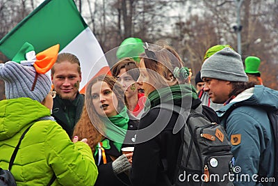 Saint Patrick`s Day celebration in Moscow. Men and women in carnival costumes Editorial Stock Photo