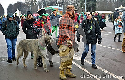 Saint Patrick`s Day celebration in Moscow. Men and women in carnival costumes Editorial Stock Photo