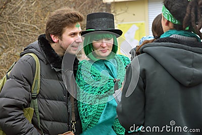 Saint Patrick`s Day celebration in Moscow. Men and women in carnival costumes Editorial Stock Photo