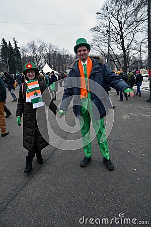 Saint Patrick`s Day celebration in Moscow. Men and women in carnival costumes Editorial Stock Photo