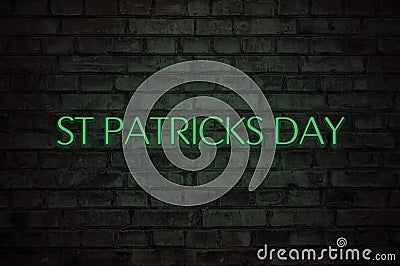 Saint Patrickâ€™s Day neon sign. Neon lettering st Patricks day on brick wall Stock Photo