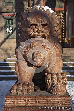 Sculpture of a guardian lion. Datsan Gunzechoyney, Saint Petersburg Editorial Stock Photo