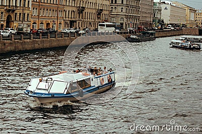 Saint Petersburg, Russia, 27 June 2019 - tourists ride on excursion boats on city water channels Editorial Stock Photo