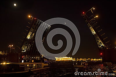 Rope-walker going between the spans of the Palace Bridge during the holiday `City Day` in St. Petersburg, Russia. Editorial Stock Photo