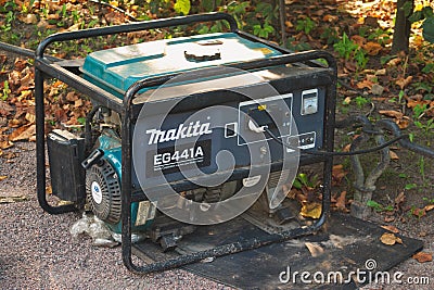 Saint Petersburg, Russia - September 08, 2018: Portable electric generator Makita for the supply of children`s attractions in the Editorial Stock Photo