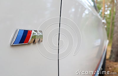 SAINT-PETERSBURG, RUSSIA:Side view of BMW X5M brand symbol in forest at July 20, 2018 Editorial Stock Photo