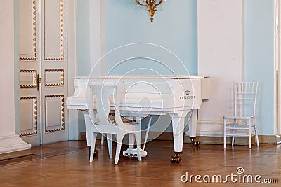 Saint Petersburg, Russia, 18.04.2019, Yusupov Palace dance hall. Baroque white piano C. Bechstein Editorial Stock Photo