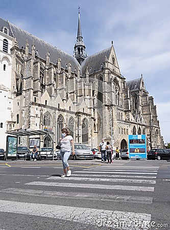 People cross road near cathedral in french town of Saint Quentin Editorial Stock Photo