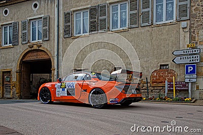 Orange Alpine in the streets of Saint-Romain Editorial Stock Photo