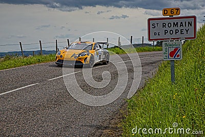 Saint-Romain de Popey road sign and a rally car Editorial Stock Photo